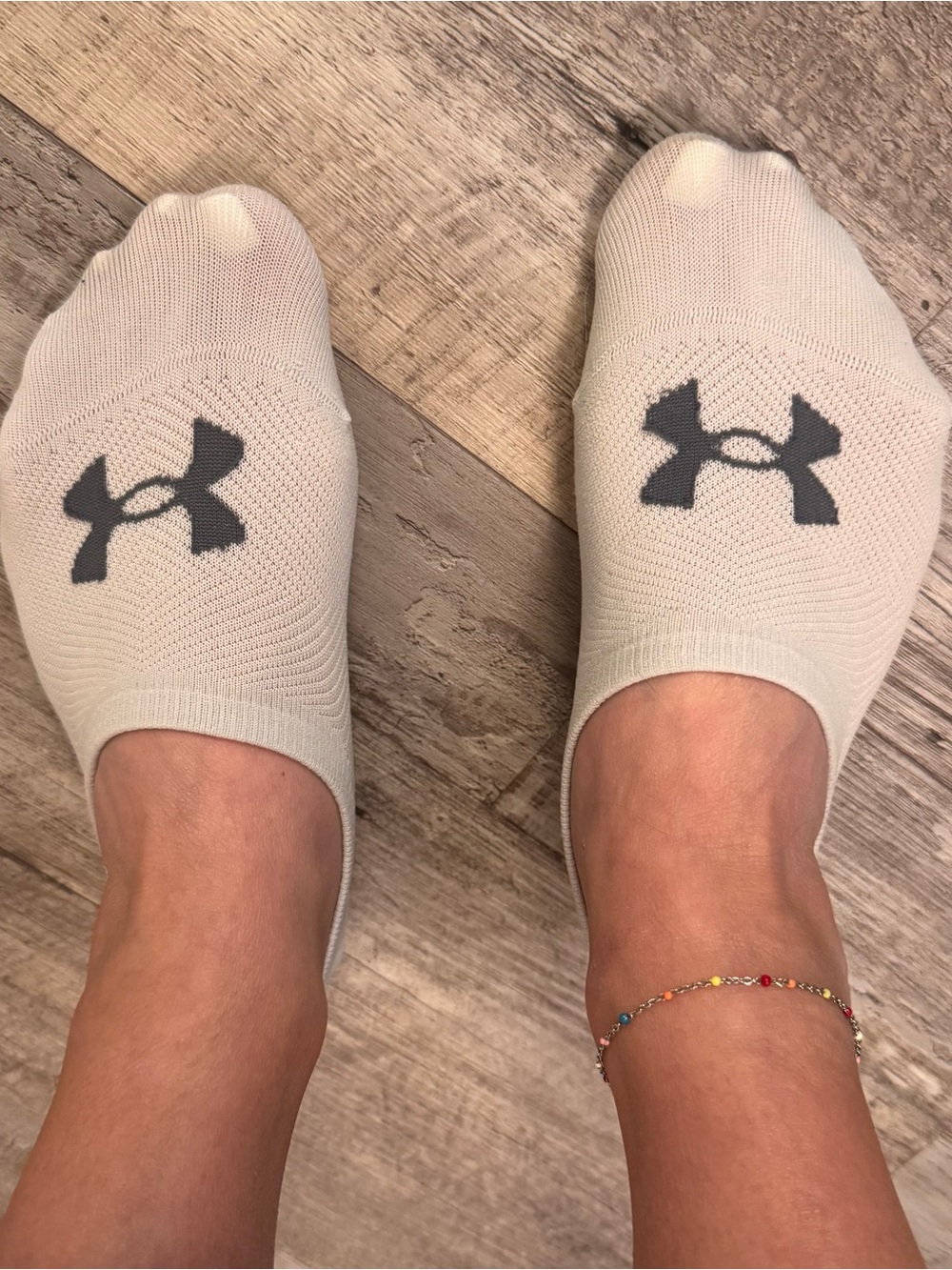 Well worn UA athletic gym socks